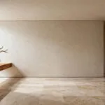 A modern bedroom designed with curated negative space, featuring large, matte-finished walls, built-in shelving, a single sculptural natural element, and soft diffused natural light, emphasizing visual calm and clarity.